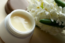 Face Cream And White Spring Flowers