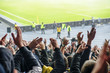 Goal! Crowd of footbal supporters and fans cheer at the studium.