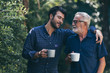 © chokniti - Old father and son, Morning coffee in a garden
