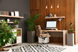 © New Africa - Comfortable workplace with computer near wooden wall in stylish room interior. Home office design