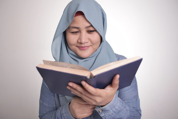 Wall Mural - Muslim Woman Reading Book, Smiling