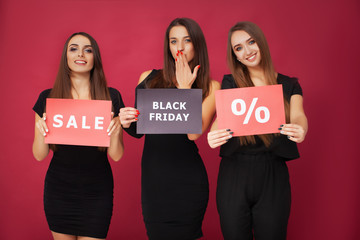 Poster - Women in black during black Friday sale on red background