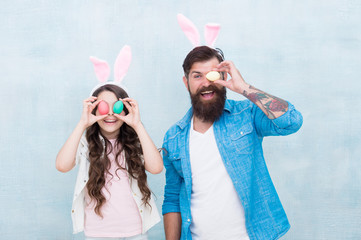 Wall Mural - Traditional food. Happy easter. Father and child celebrate easter. Spring holiday. Easter activities for family. Holiday bunny long ears. Family tradition concept. Dad and daughter bunny ears