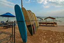 Surfing Boards And Umbrellas On Sri Lanka Beach