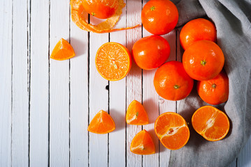 Canvas Print - tangerines with gray canvas on white wooden