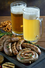 grilled sausages with a glass of beer