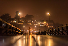 Beautiful Night Time Of Silhouette Traveler Walking On The Mon Wooden Bridge With Beautiful Reflections.