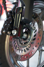 Close-up Of Motorcycle Brakes And Front Wheel