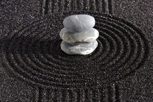 Japanese Zen Garden With Stone In Textured Sand