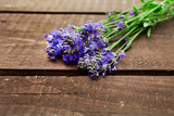 Fototapeta Lawenda - Fresh lavender flowers on a wooden background.