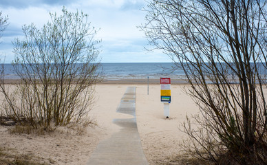 April 25, 2018 Jurmala, Latvia. Wooden walkway on the sandy beach of the Baltic Sea in Jurmala.