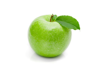 Ripe green apple with leaf on a white background .