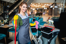Beautiful Young Woman Cleaning At Shopping Mall. Cleaning Concept.