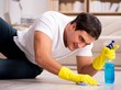 © Elnur - Man husband cleaning the house helping wife