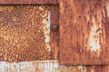 Old rusty metal sheet. The rusty metal background.