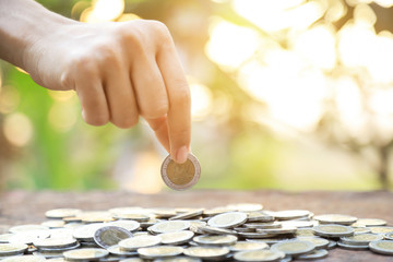 hand hold coin for saving money of good finance concept 