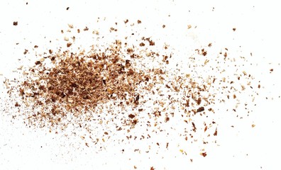 Small wooden shavings of sawdust on a white background.