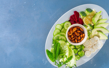 Canvas Print - Plate of vegetarian food top view. Balanced and diet food. Fresh vegetables Copy space. Top view