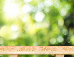 Aufkleber - Empty wood plank table top with blur tree in park with bokeh light at background,Mock up template for display of your design,Banner for advertise of product