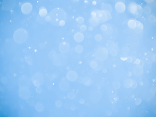 Abstract blue bokeh background.Blurred bright light.