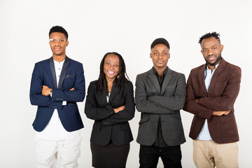 team of young african people in suits on a white background with phones in their hands