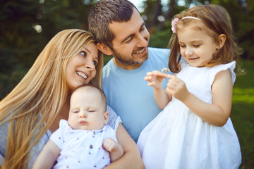 Wall Mural - Mother father and children funny laughing outside