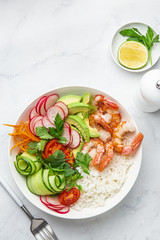 Canvas Print - Avocado, shrimps, cucumber, tomato, radish, carrot and rice salad bowl. Healthy food.