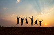 © AungMyo - Silhouette group of happy children jumping playing on mountain at sunset, summer time