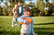 © Svitlana - Vacay mode. Little boy playing frisbee in the park on a sunny day