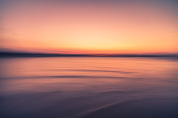 Wall Mural - tropical beach with sunset sky and cloud background.