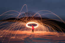 Fire Show With Lot Of Sparks In Night Winter Mountains. Landscape Photography