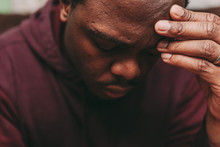 Black African American Man Depicting A Sad Depressive State, Depression Concept