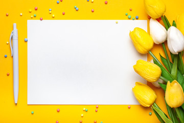 Wall Mural - bouquet of spring tulips on a bright background. greeting card. space for text.