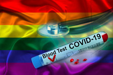 Test Tube With Coronavirus Blood Test, Medical Stethoscope, Lies On The Silk National LGBT Rainbow Flag, Pride Flag, SARS-CoV-2 Virus Concept, Coronavirus, COVID-19