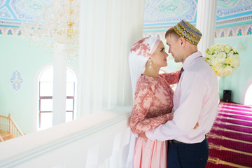 Islamic couple in a mosque on a wedding ceremony. Muslim marriage