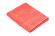 coral towel lies on a white background of isolate