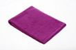 purple towel lies on a white background of isolate