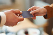 © Kalim - Closeup portrait of two successful business executive exchanging business card