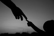 © Kostia - silhouette the parent holds the hand of a child