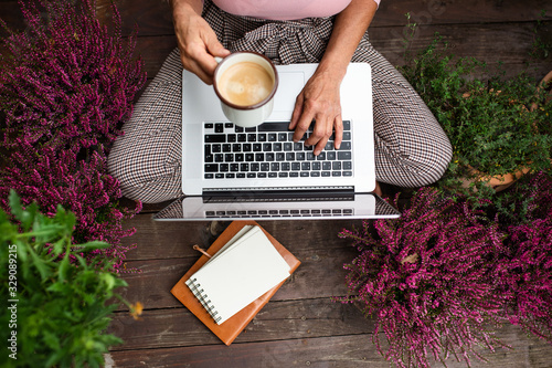 Cuadros en Lienzo Top view of senior woman with laptop sitting outdoors on terrace, working