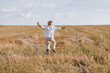© pressahotkey - blond little boy playing hay in the field. summer, sunny weather, farming.