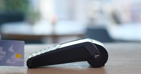 Sticker - Woman with credit card using payment terminal in cafe, closeup