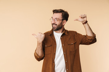 Wall Mural - Portrait of a cheerful young arttractive bearded man