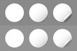 © Roman - Rounded adhesive paper stickers set with shadow. Circle white tags with a folded edges. Blank templates of adhesive symbols  with peeling corner. Isolated on transparent background. Vector.