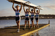 © Wavebreak Media - Teammates carrying the rowing boat together