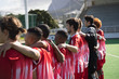 © Wavebreak Media - Hockey players standing on pitch before match