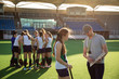 © Wavebreak Media - Female hockey players preparing match on the field