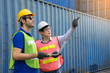 © Supavadee - Warehouse laborer with engineer wearing a hardhat unloading works with forklift loader at the container yard and Check container integrity Before exporting products abroad. Transportation concept.