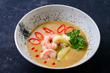 Sticker - thai traditional tom yam kung soup in a white bowl