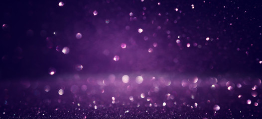 Wall Mural - background of abstract glitter lights. black and purple. de focused